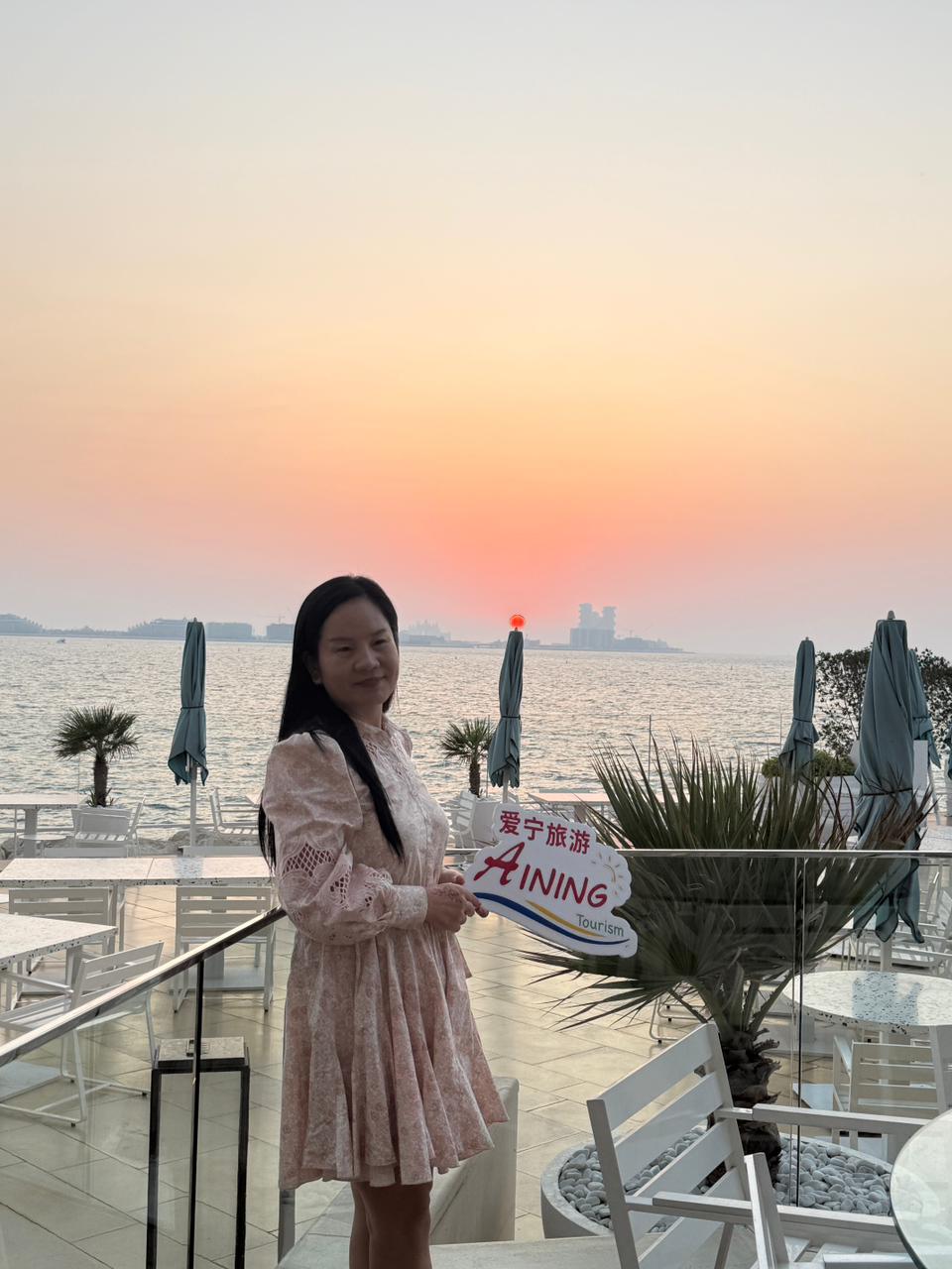a woman with a red headband and necklace