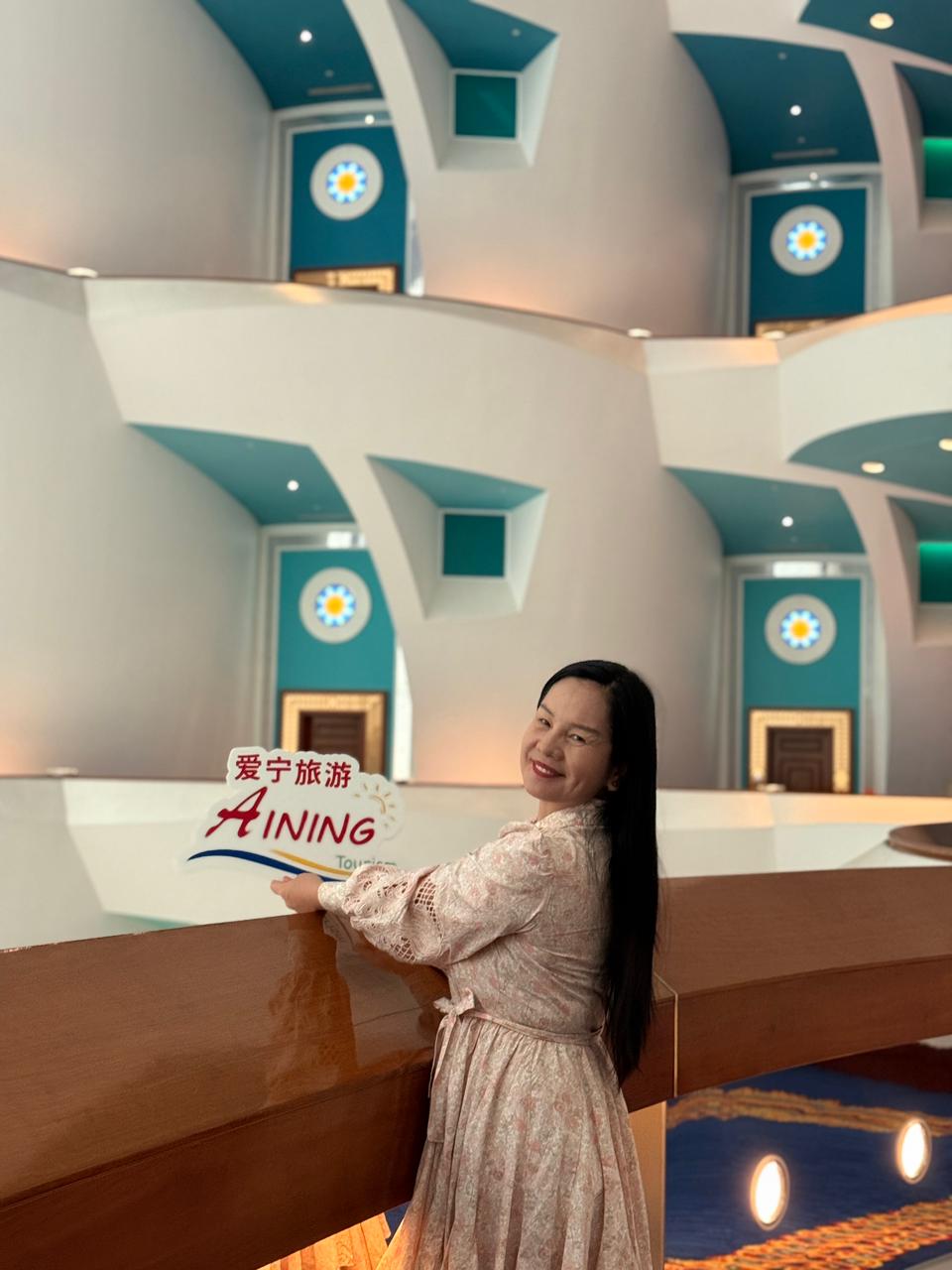 a woman with a red headband and necklace